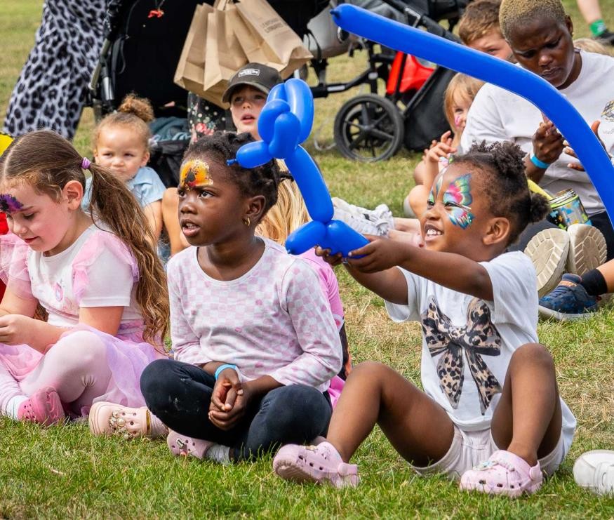 Children with balloon models at Summer Fun 2025